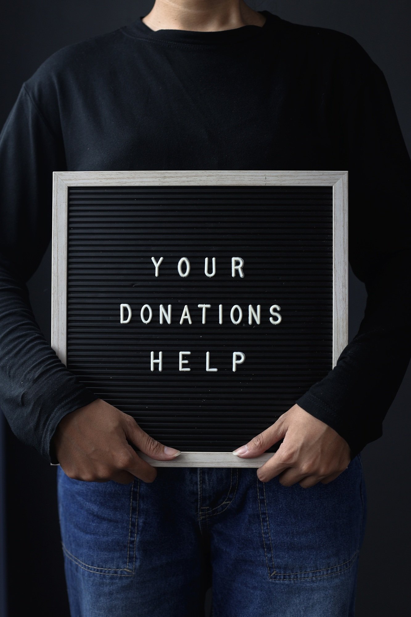 Letterboard with word your donation help